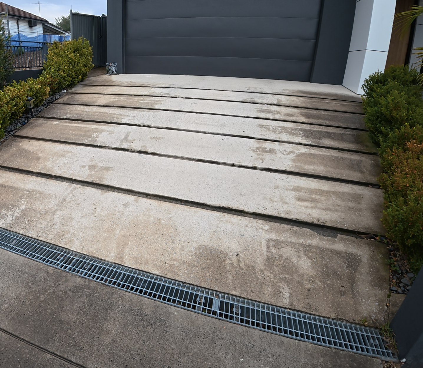 Mega Clean technician pressure cleaning an outdoor surface