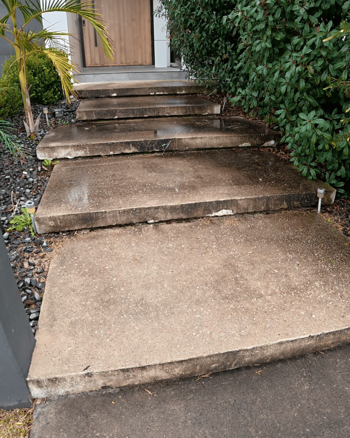 Mega Clean technician pressure cleaning an outdoor surface