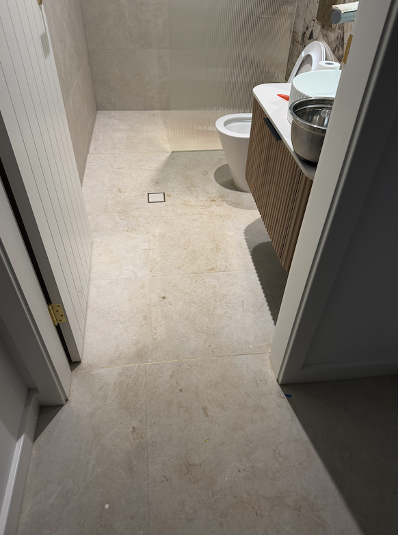 Before and after grout cleaning by Mega Clean