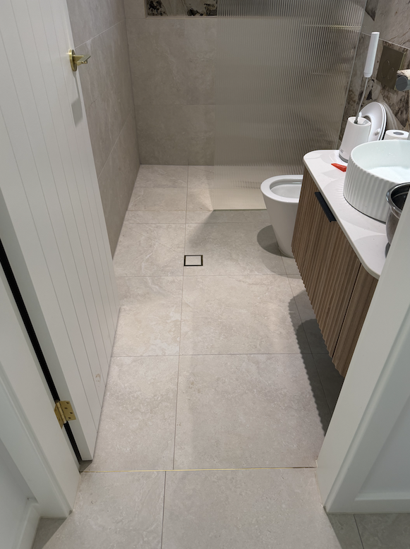 Before and after grout cleaning by Mega Clean