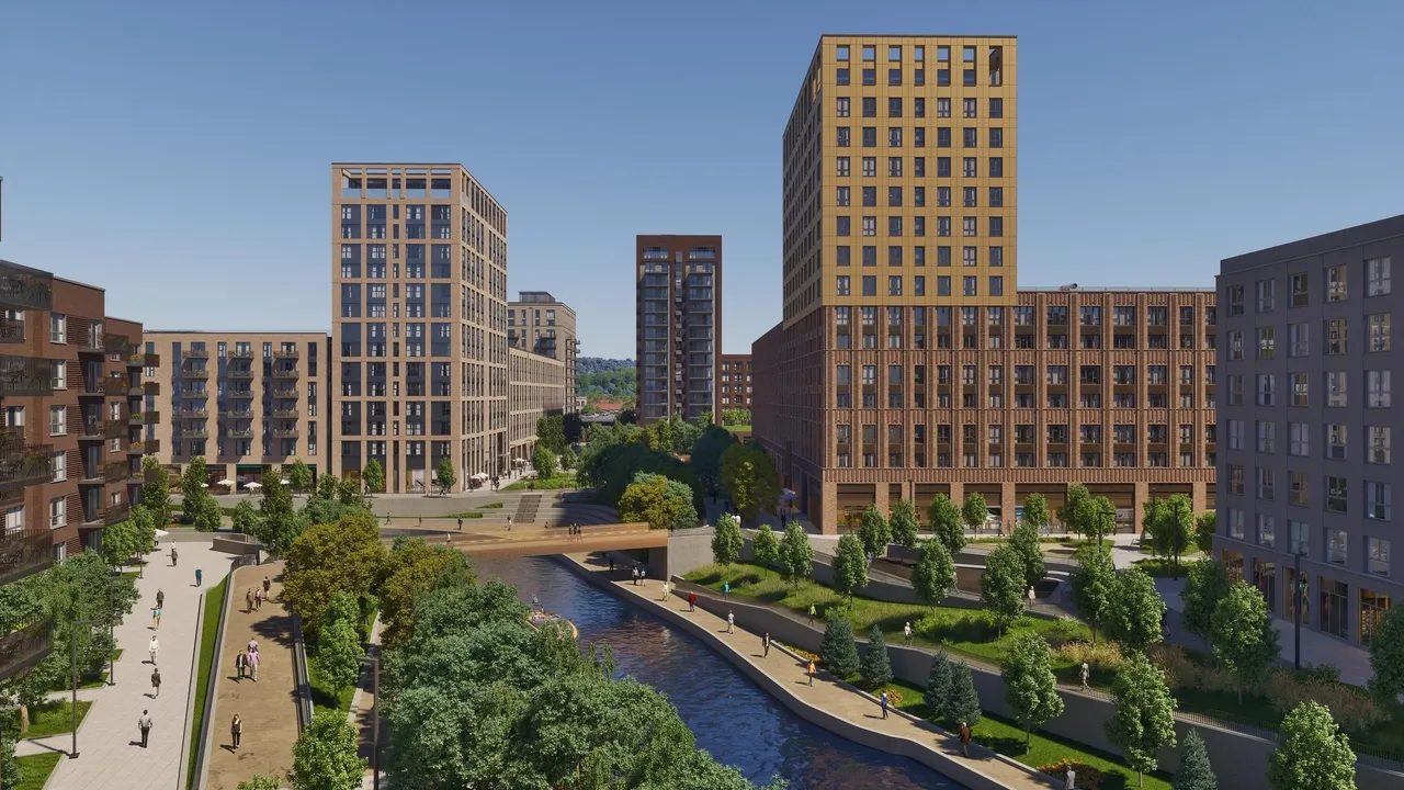 multiple high-rise buildings surrounding a river with paths on either side