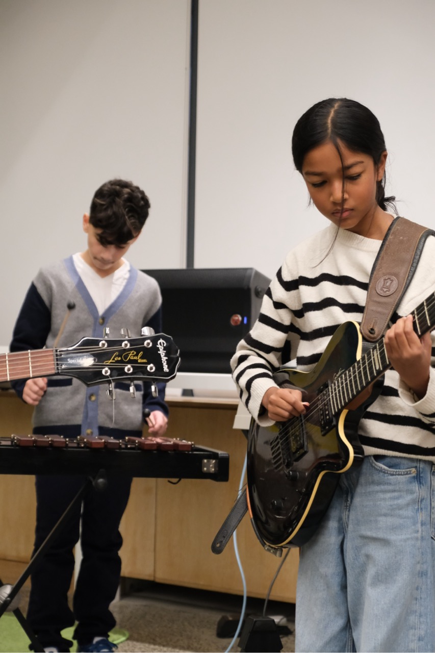 Middle school students during band practice - playing on their instruments