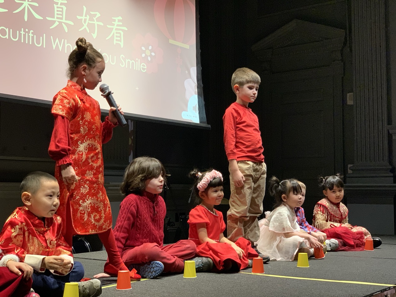 Students on stage in the Lunar New Year performance at Pine Street School