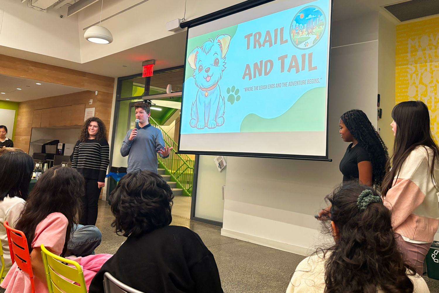 Students presenting their project at the Annual AI Design Sprint at Pine Street School to an audience of peers, industry leaders, and faculty
