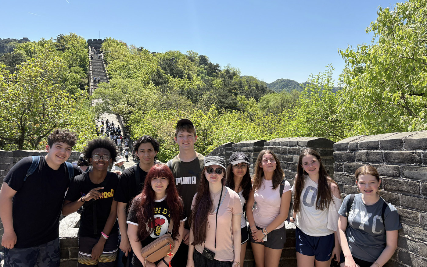 Middle school students take a group picture on the Great Wall of China during the International China Trip