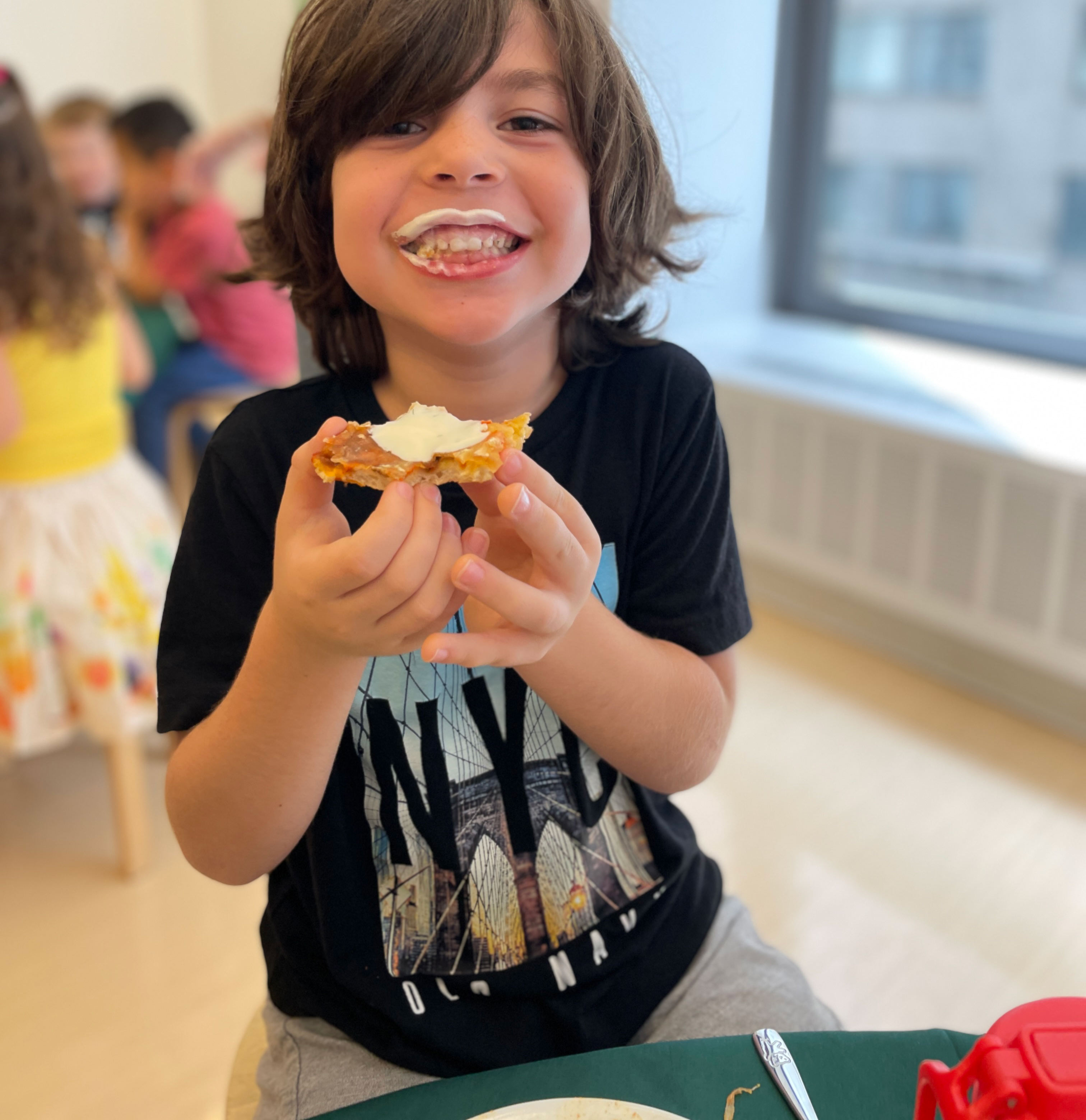 Student enjoying his meal at Pine Street School