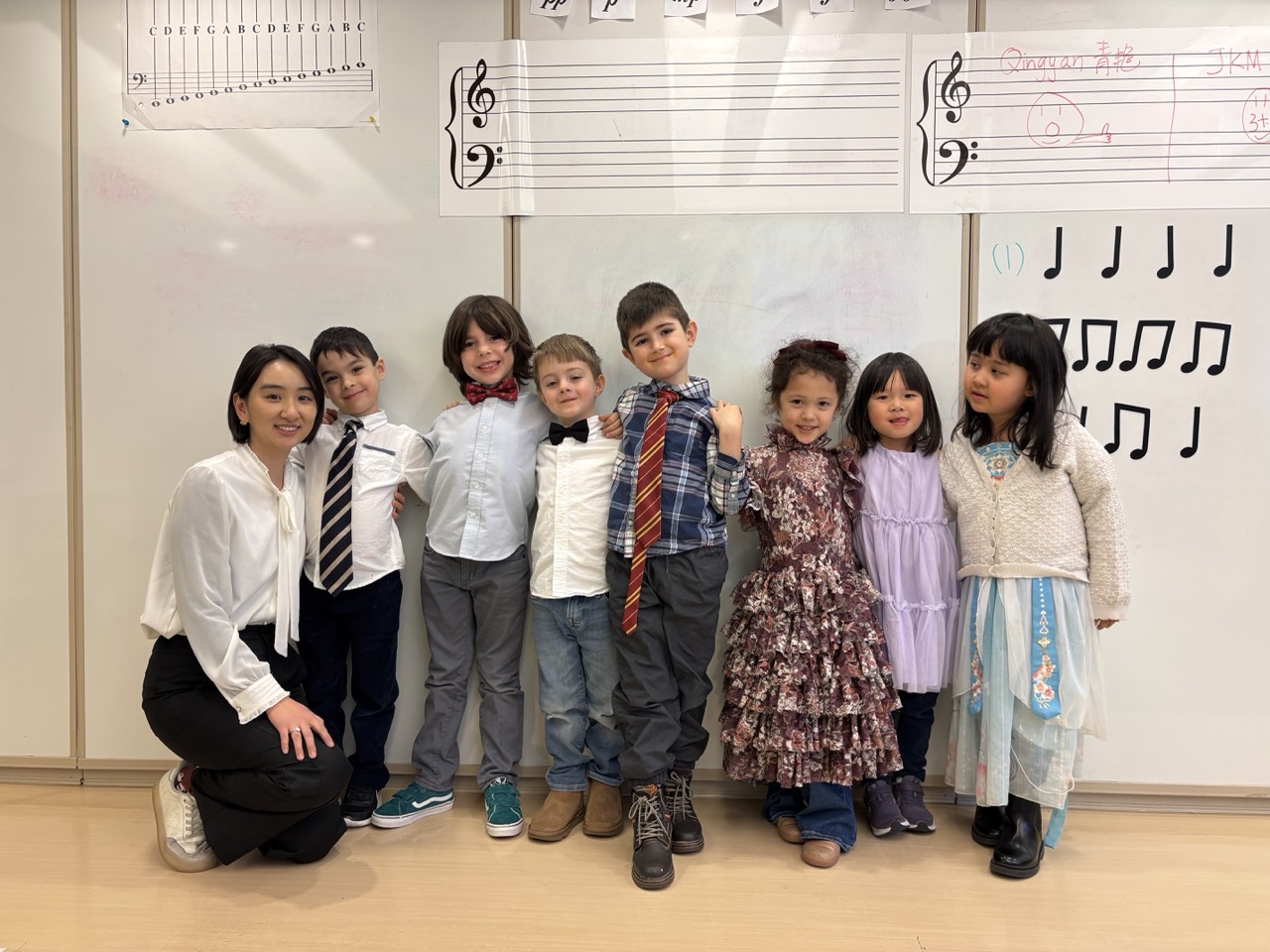 Students and teacher group photo in music classroom