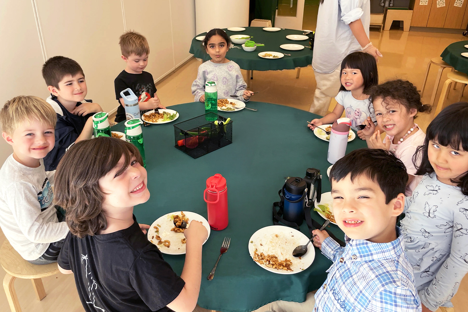 Students share stories and meals in the lunch room.