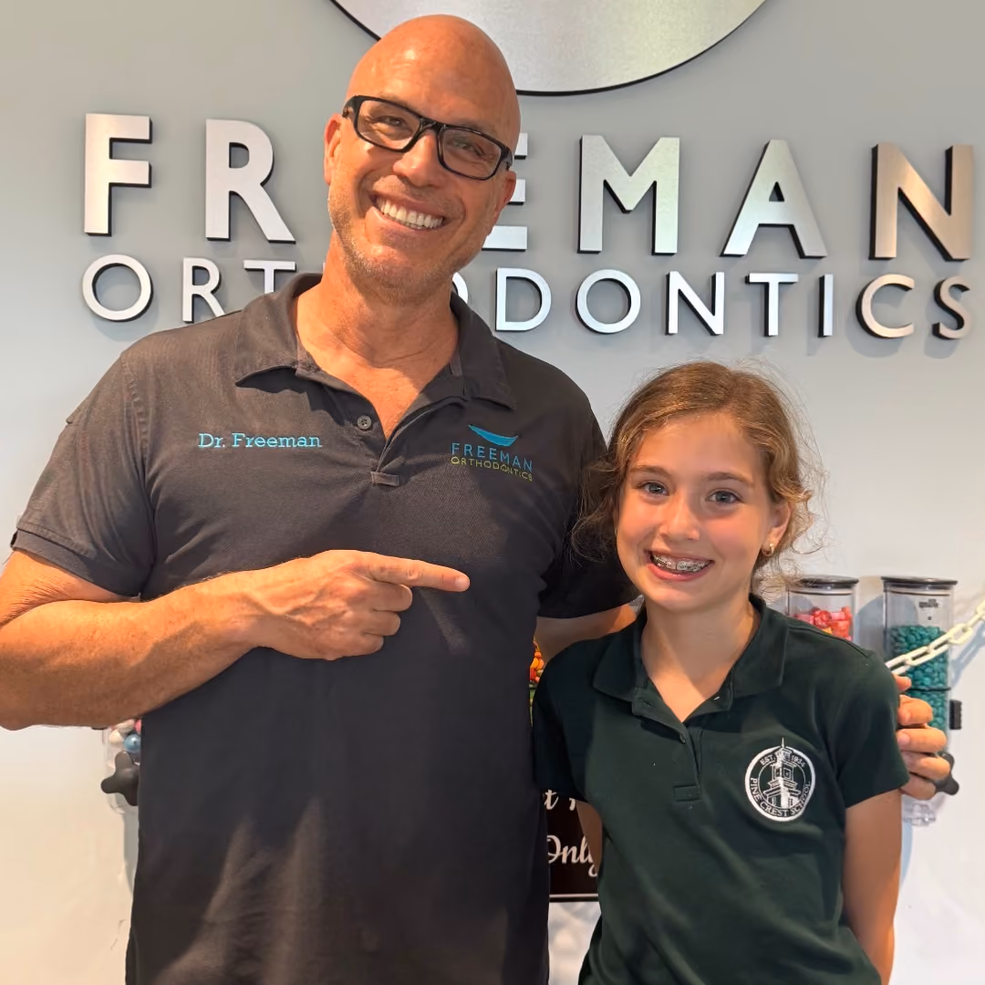 Patient with metal braces at Freeman Orthodontics