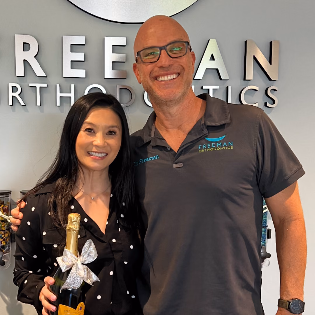 Adult smiling after orthodontic treatment at Freeman Orthodontics