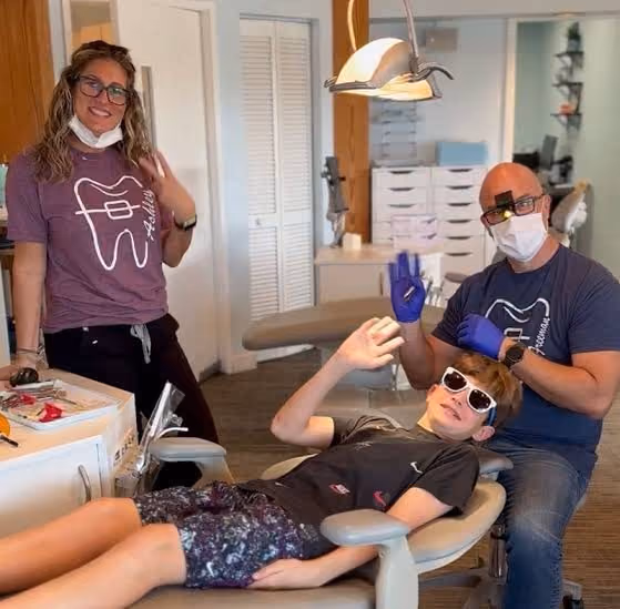 Dr Freeman with a patient in the office