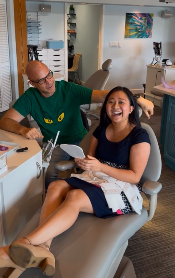 Smiling adult patient during an appointment with Dr. Freeman.