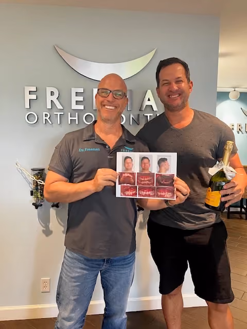 Adult patient with Dr. Freeman after orthodontic treatment.