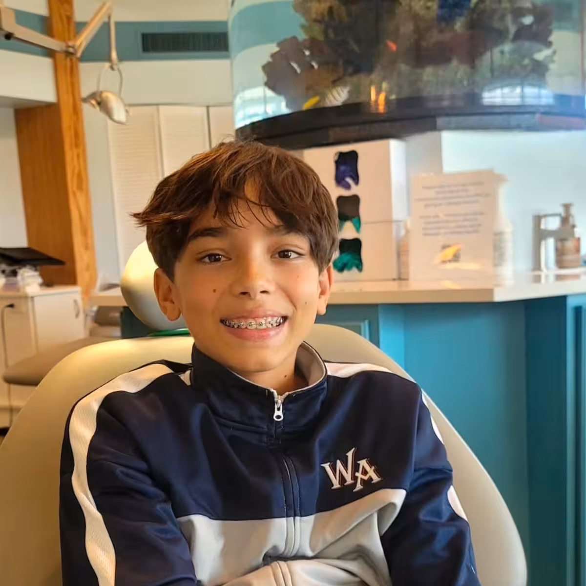 Teen boy with braces at Freeman Orthodontics