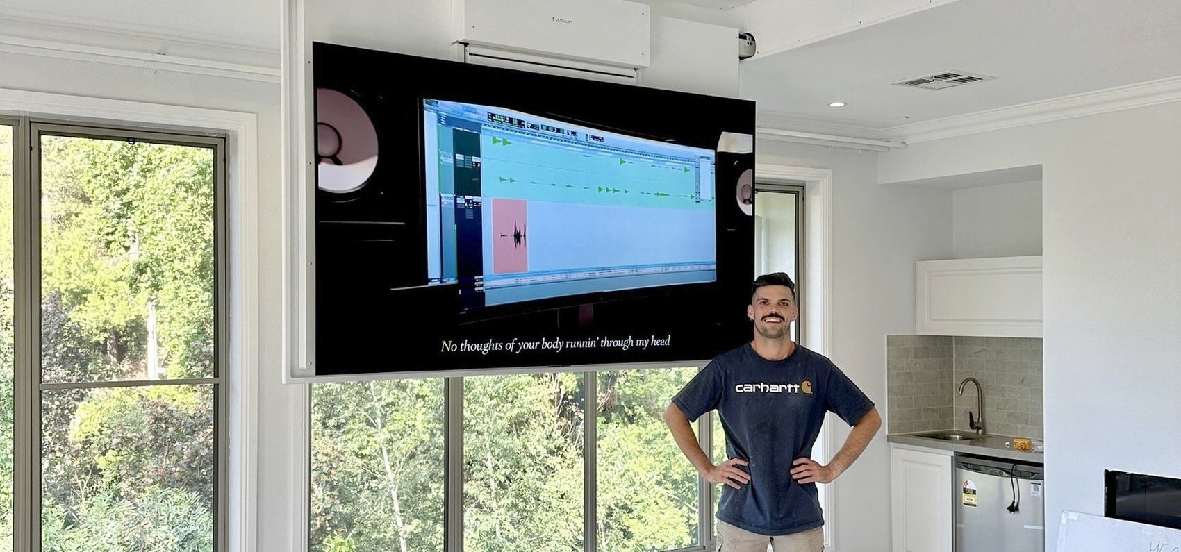 Matt from BBH Electrical with a completed motorised ceiling TV installation.
