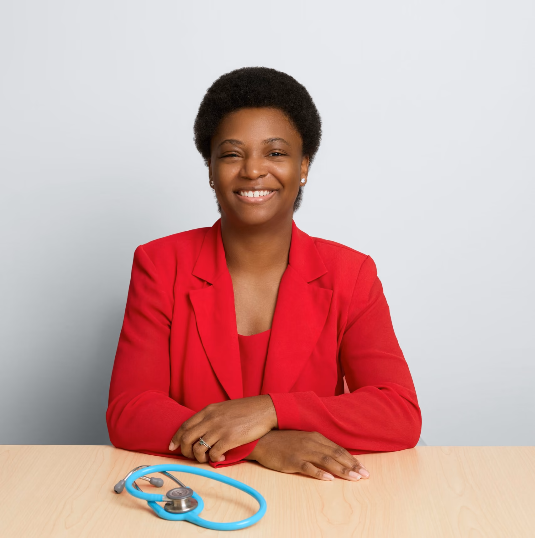 Headshot of Ke'Arah Tate with a blue stethoscope 