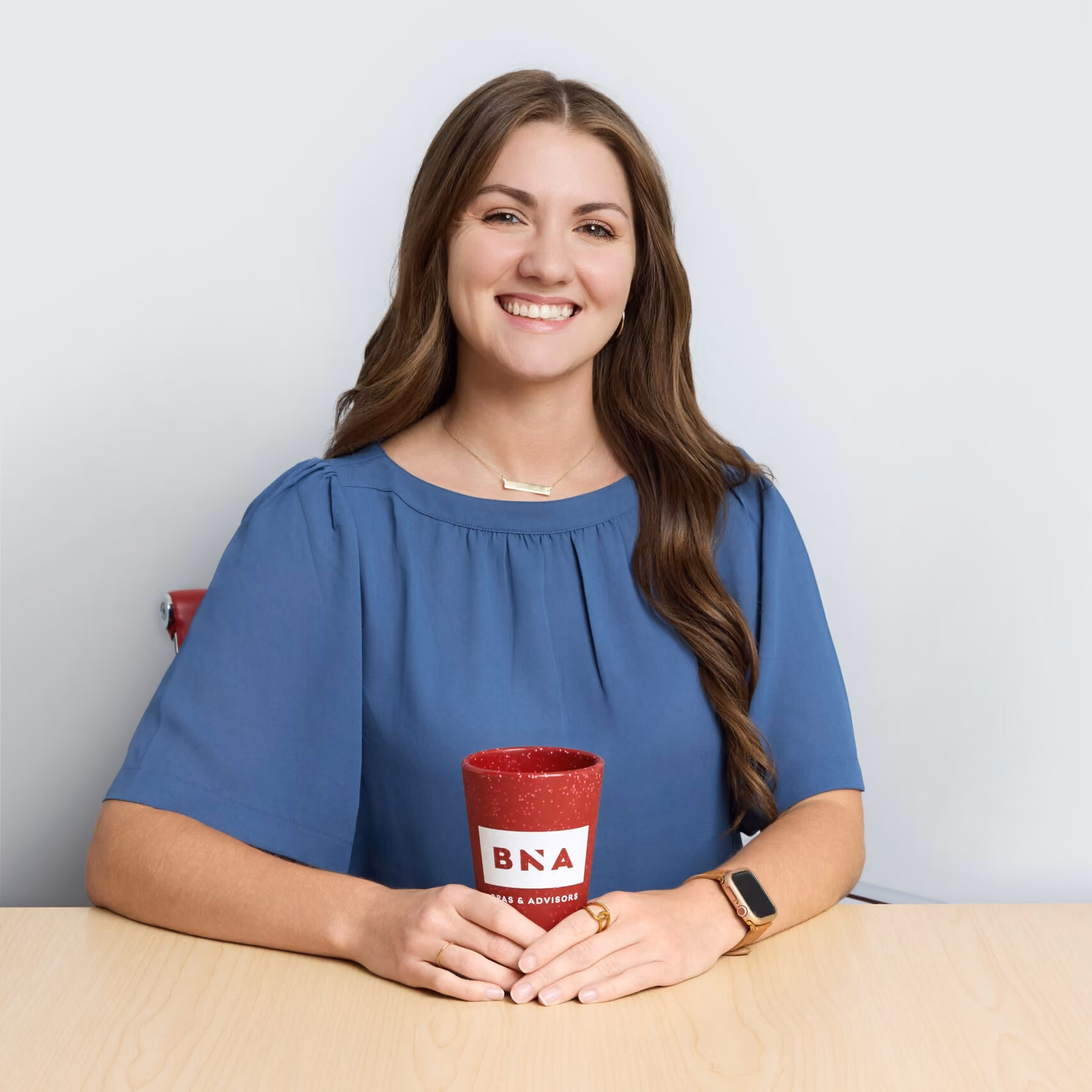 Headshot of Elissa Johnson holding a red BNA branded cup