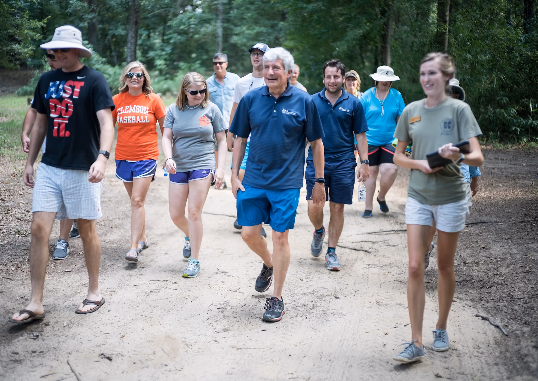 Group of BNA employees walking along a hiking trail