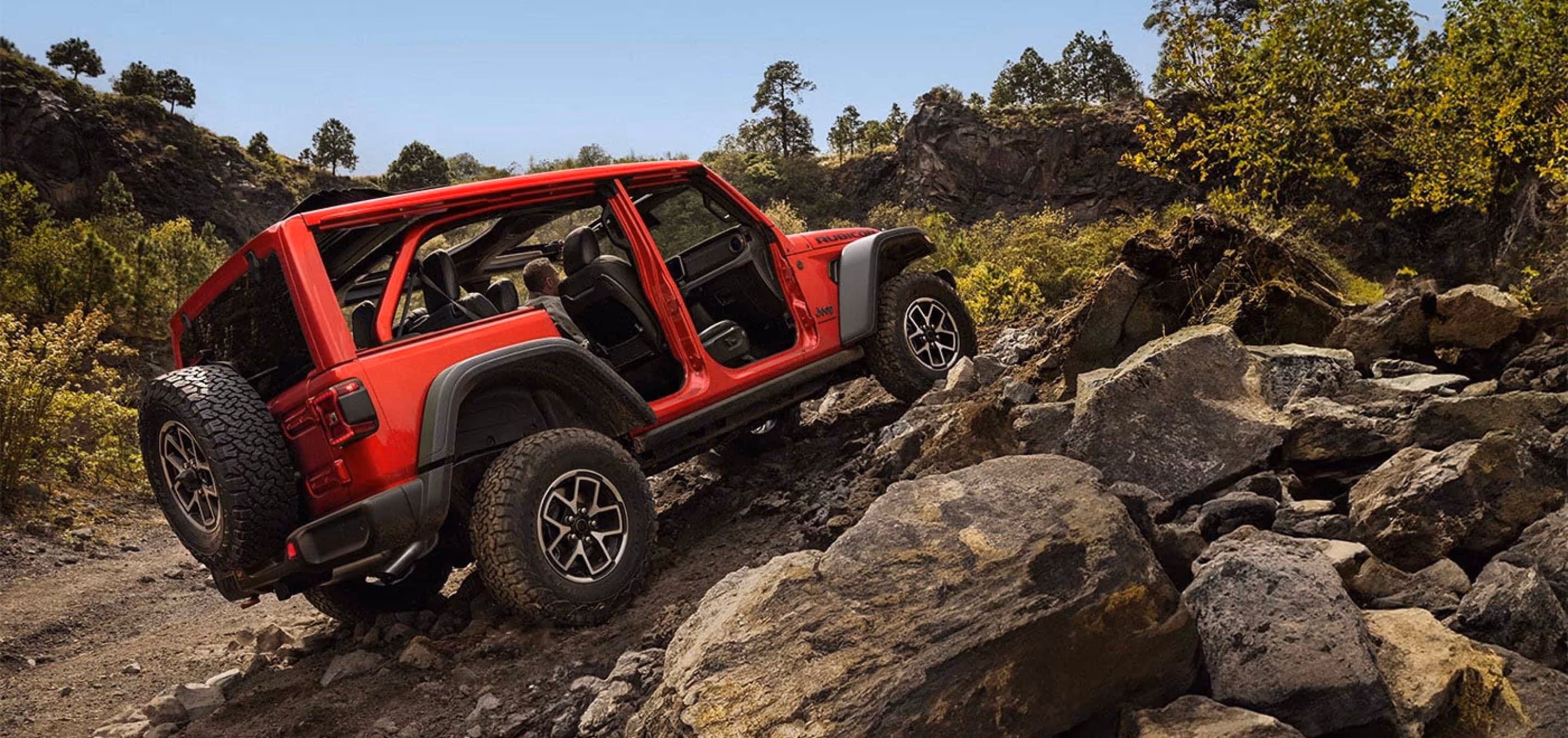 Jeep going over rough terrain