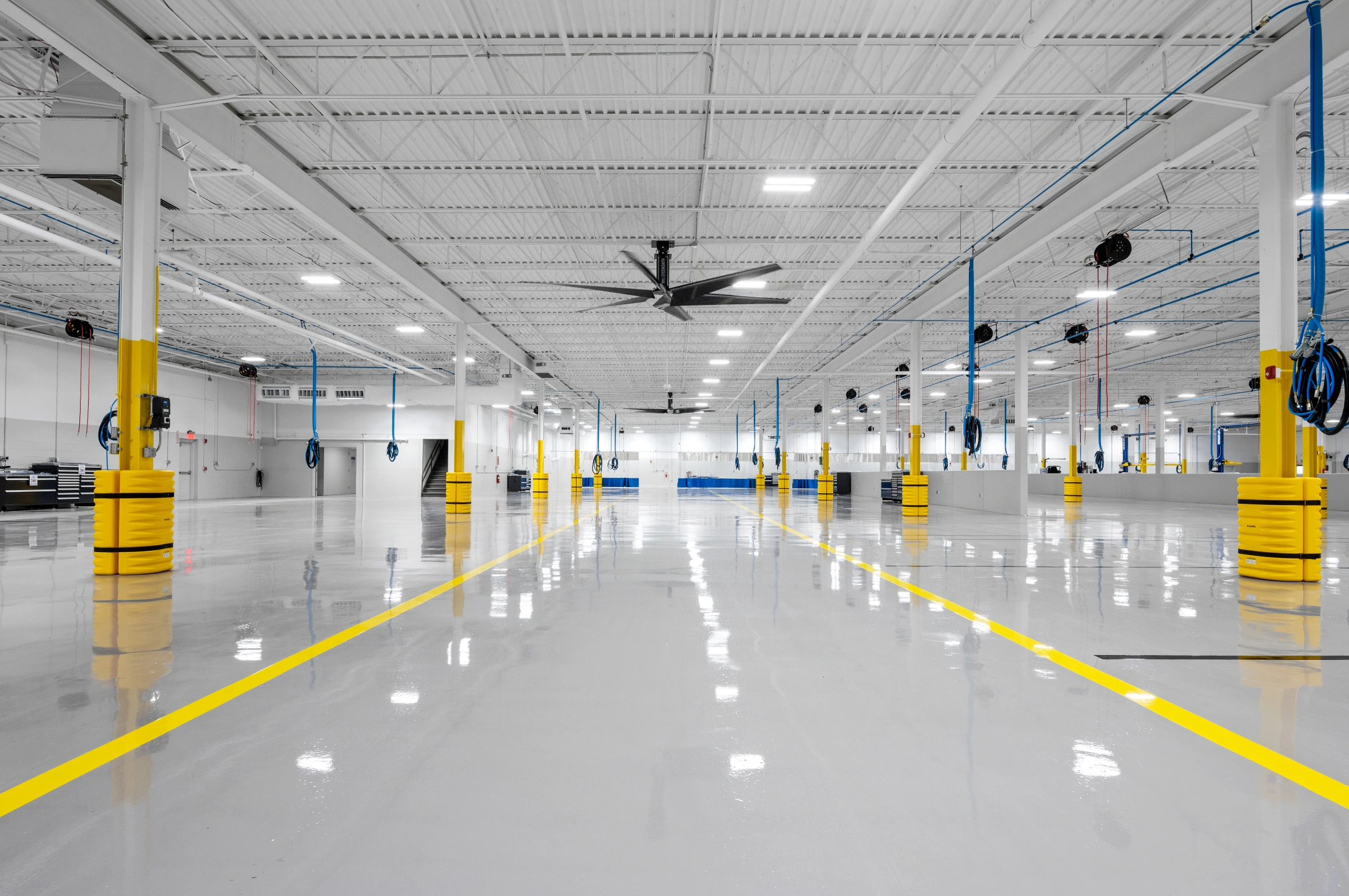 Pristine shop room floor and repair bays at Century Collision Center.