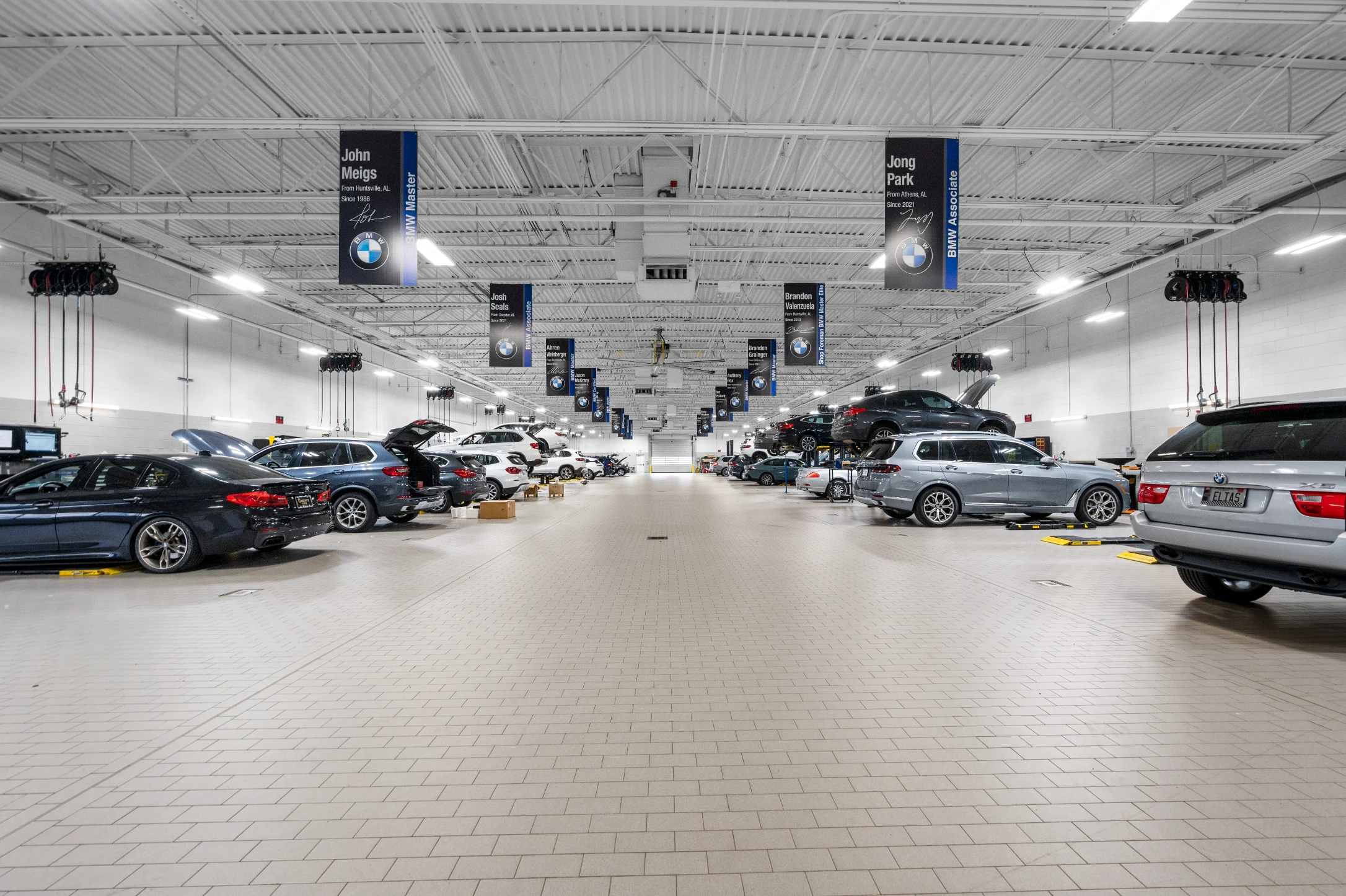 Alternate view of shop floor filled with cars at Century Collision Center.