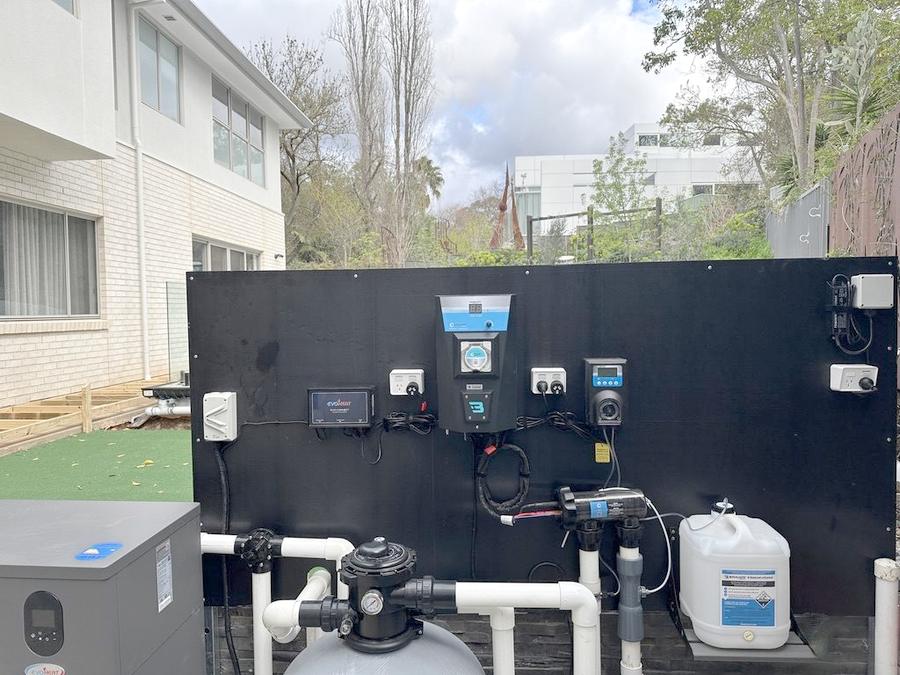 Pool pump and filtration equipment wired at a residential pool.