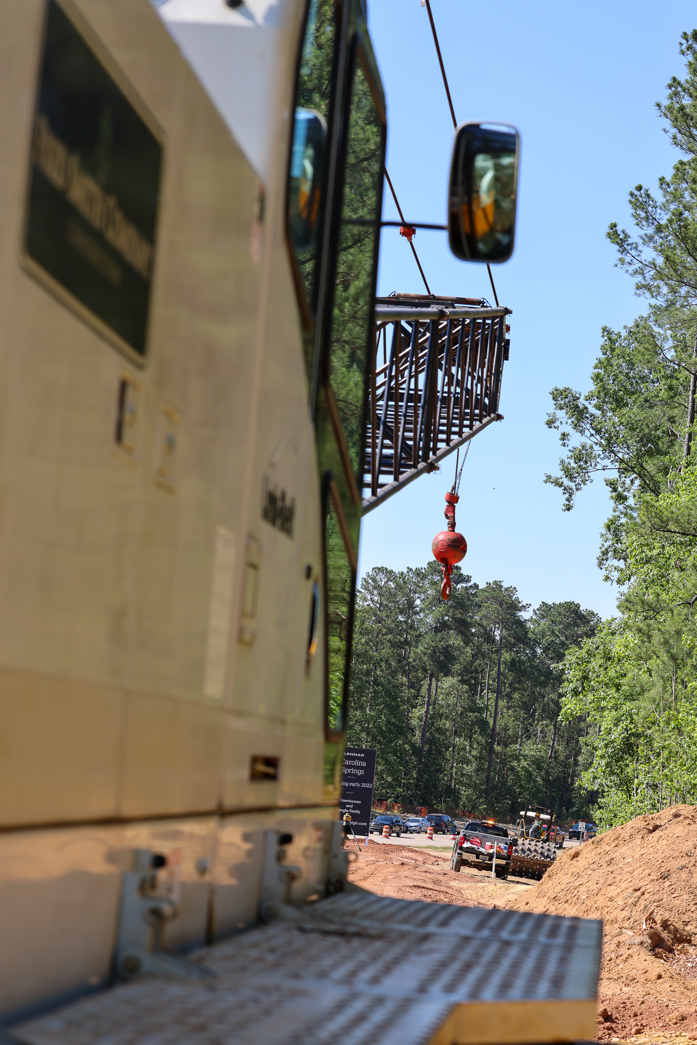 Crews placing a bridge deck at night under floodlights