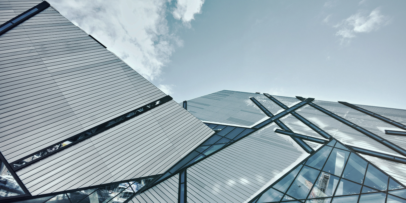 Contemporary building with triangular windowed facade design