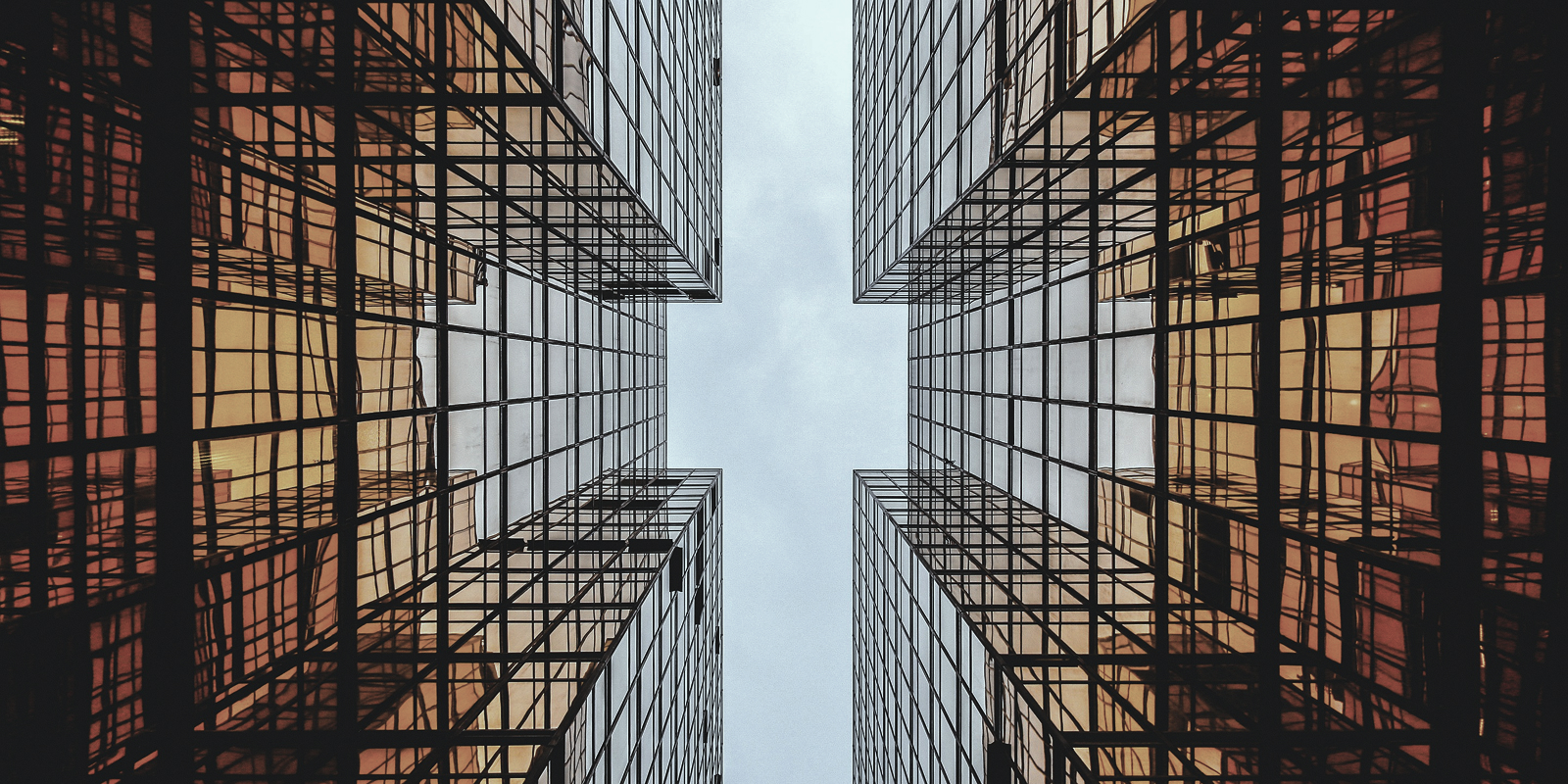 Modern commercial building featuring a mirrored glass exterior