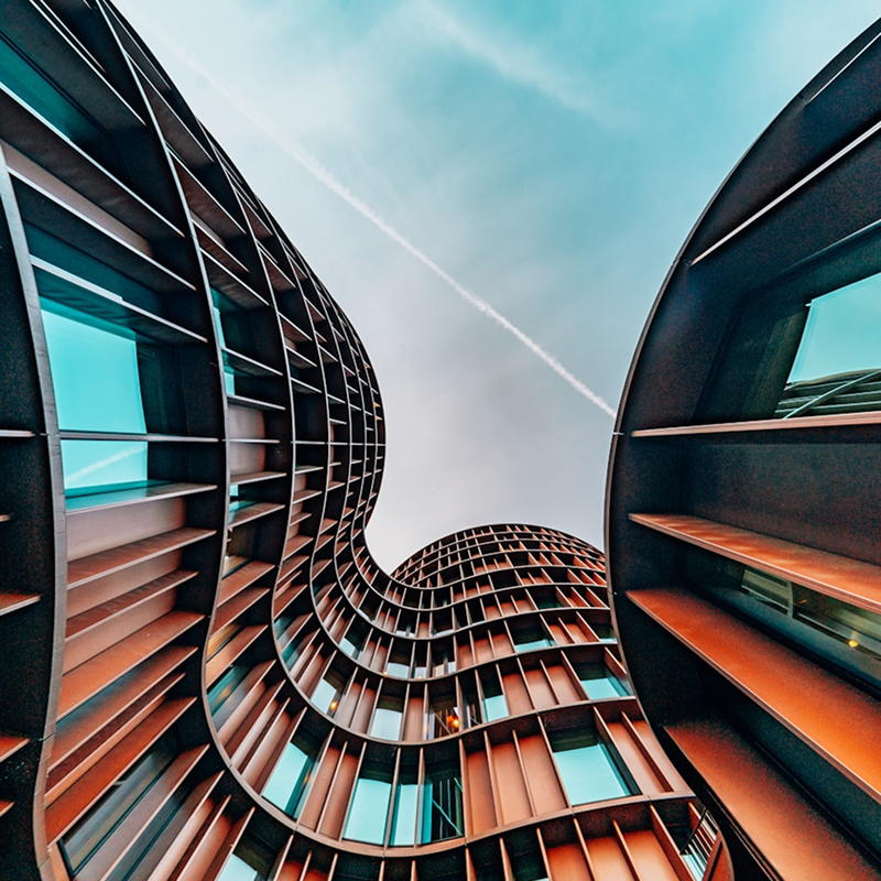 Curved exterior of a sleek modern commercial building