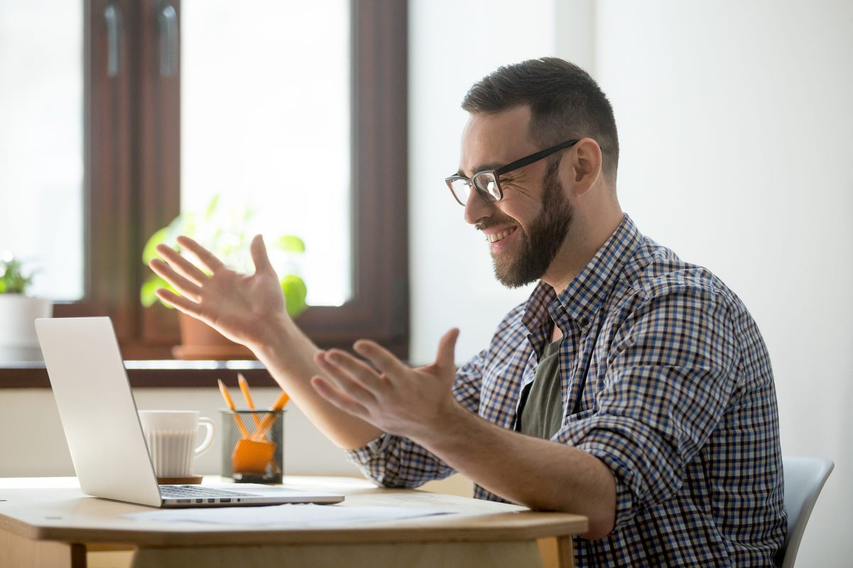 School leader in an online coaching session at a laptop