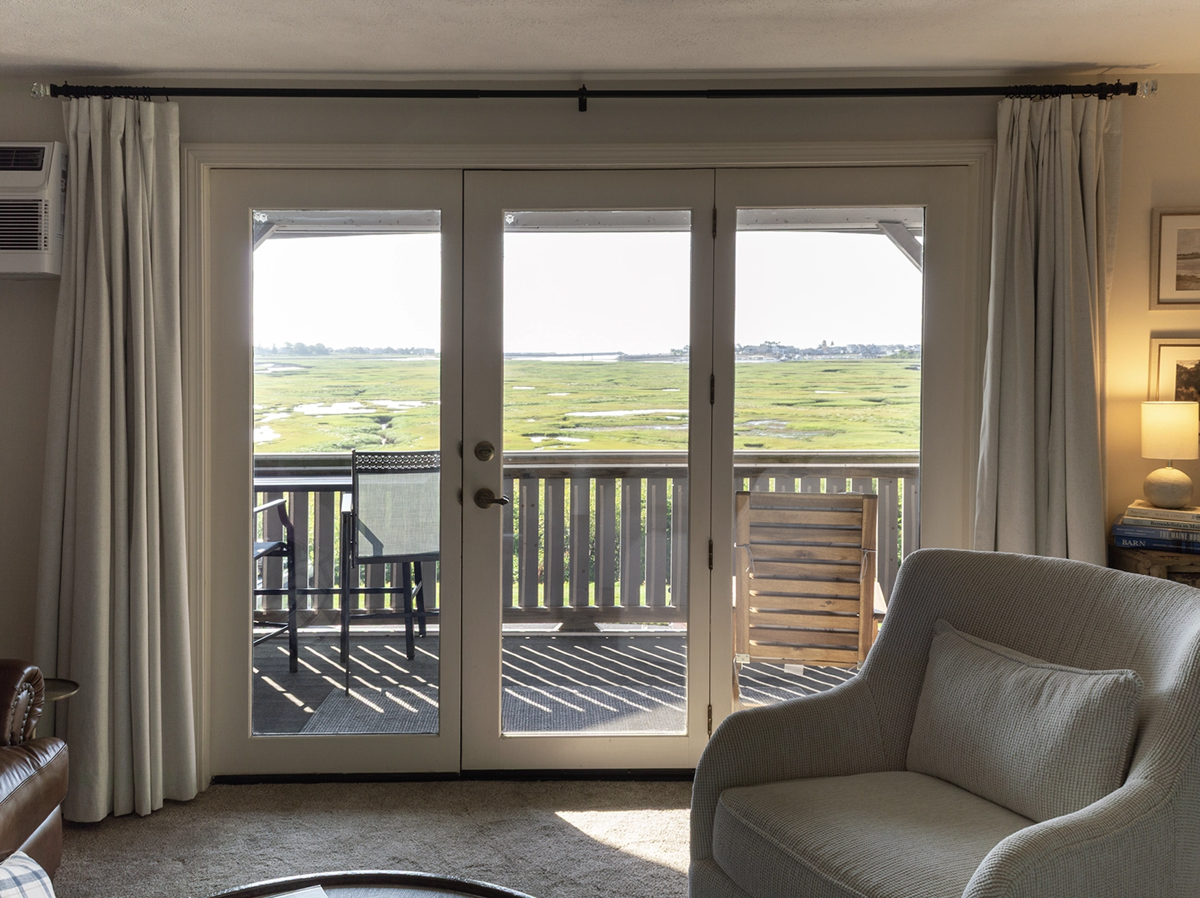 Living room and balcony  at The Salt Marsh Retreat