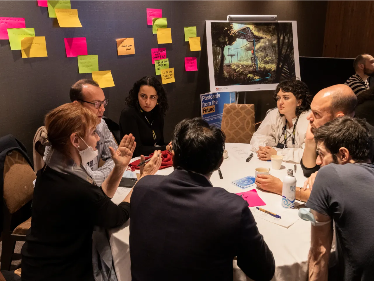 A group sitting around a table during a workshop