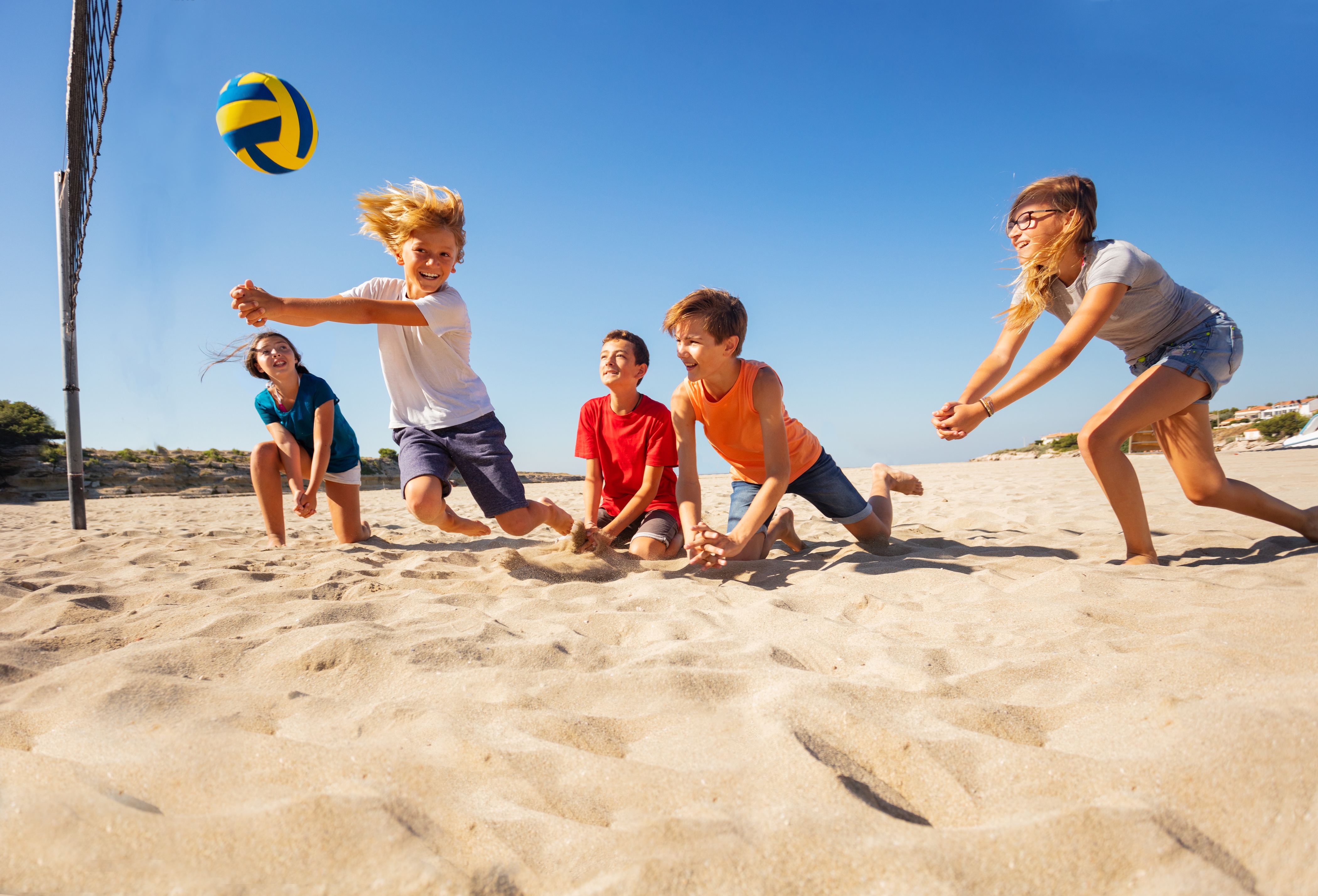 Kids playing at the beach stock image