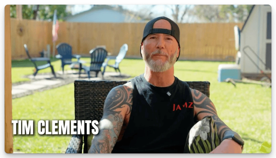 Customer Tim Clements gives a video testimonial in front of the new cedar wood fence installed by Fast Eddie's Fast Fences.
