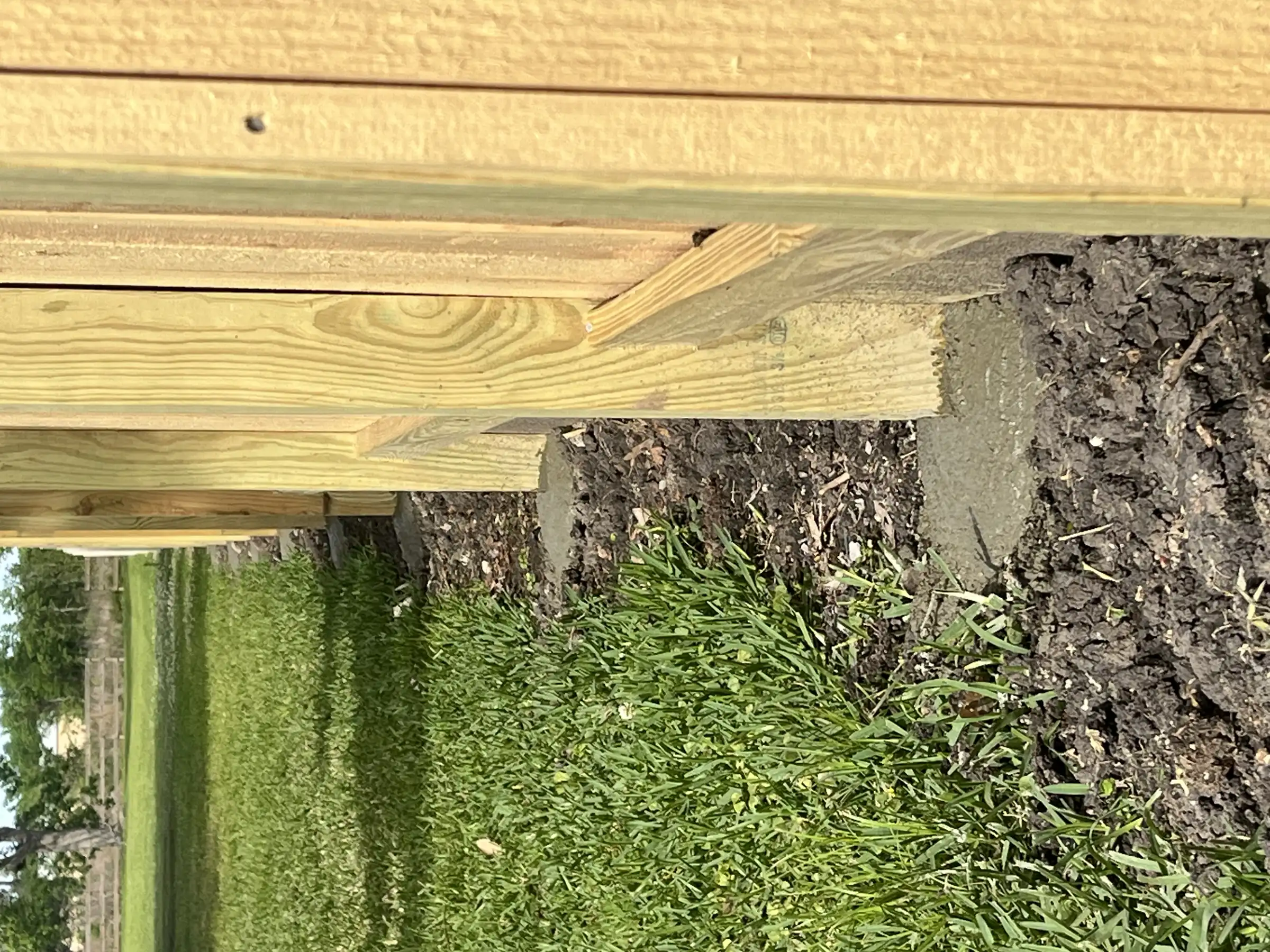 Split rail wood fence panel in a backyard