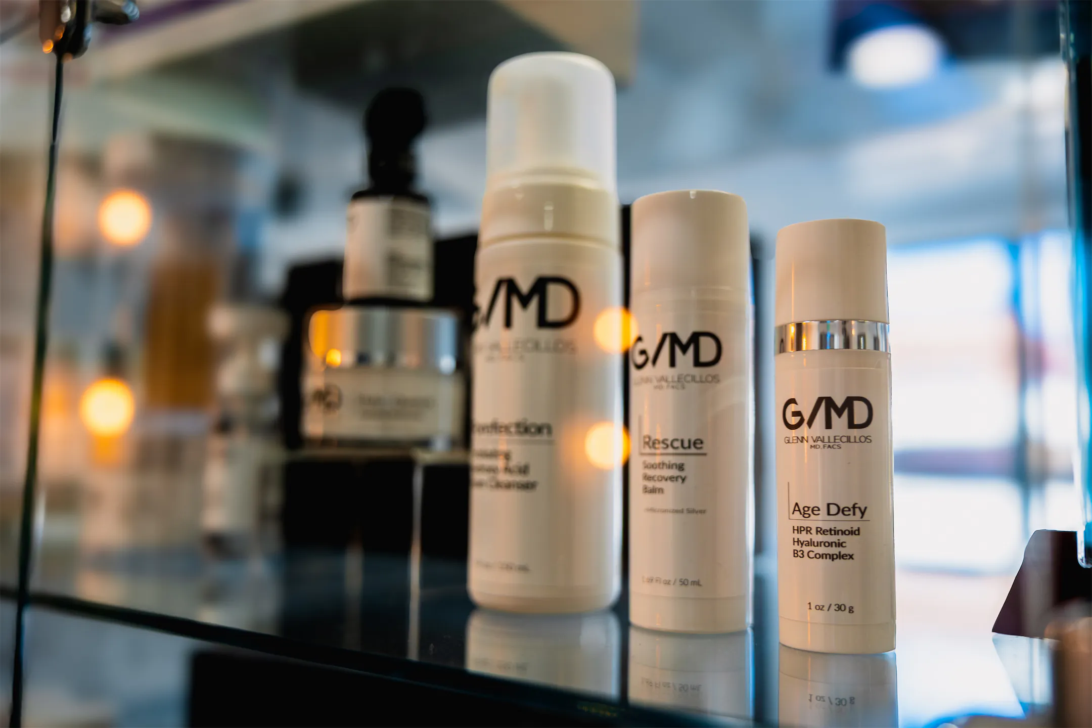 GVMD-branded skincare products displayed on a glass shelf