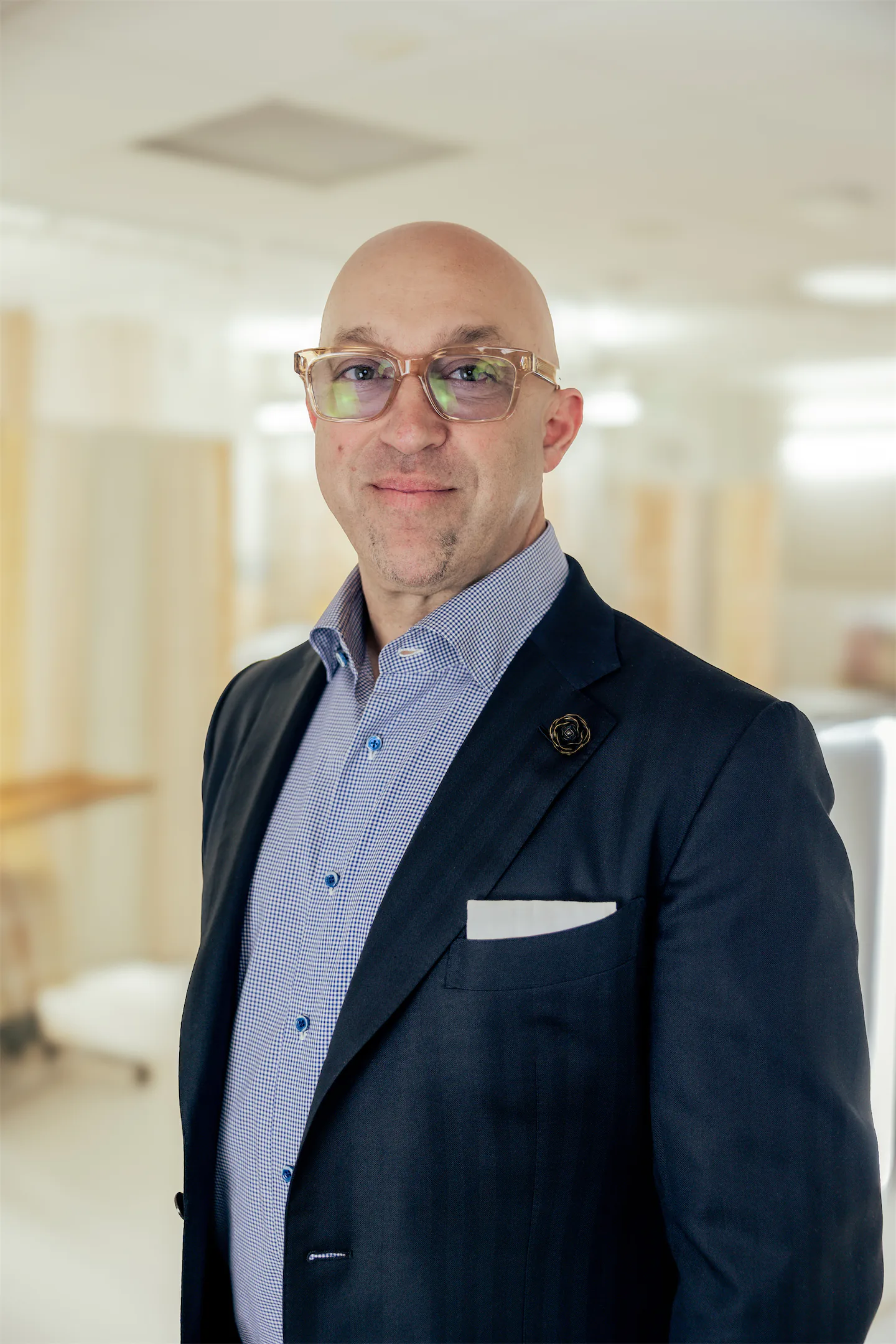 Portrait of Dr. Vallecillos smiling in the office