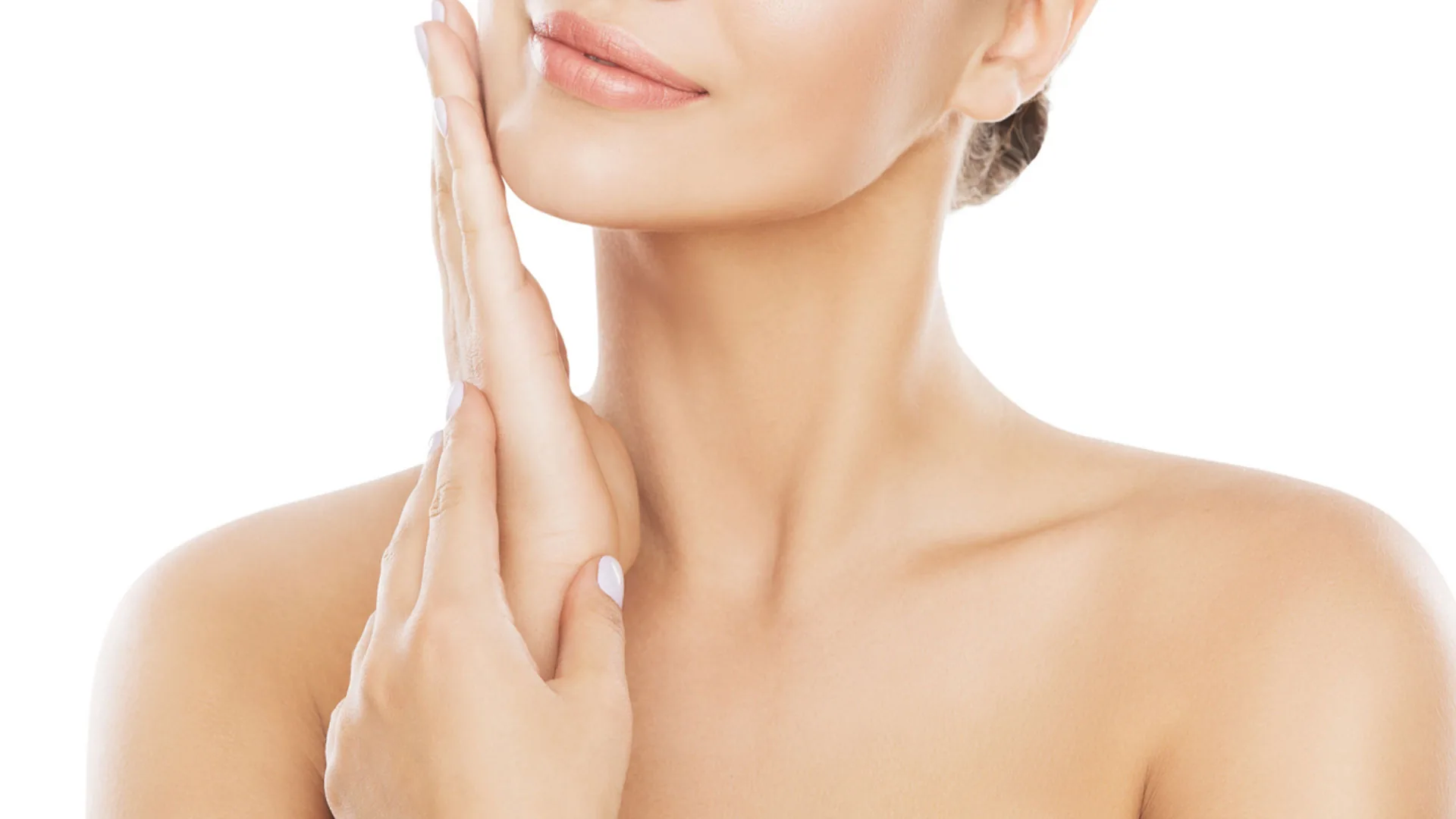 Woman's jawline and neck with her hand resting along her cheek