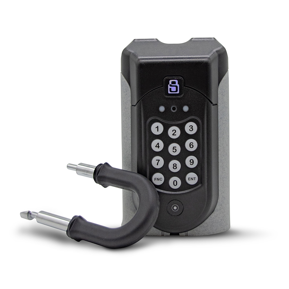 A SentriGuard lockbox with the shackle released, resting on the side.