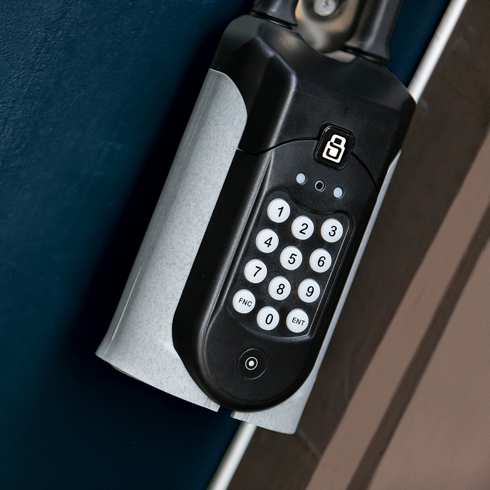 A SentriGuard lockbox mounted to a door handle.