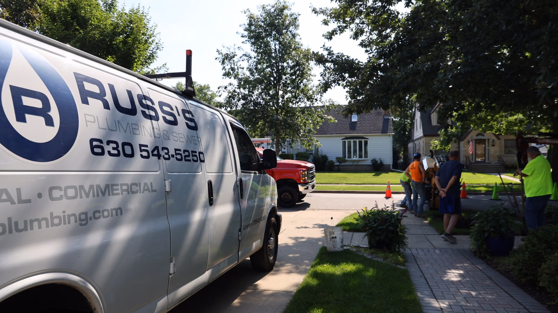 white-russ-plumbing-service-truck-working-on-job-site