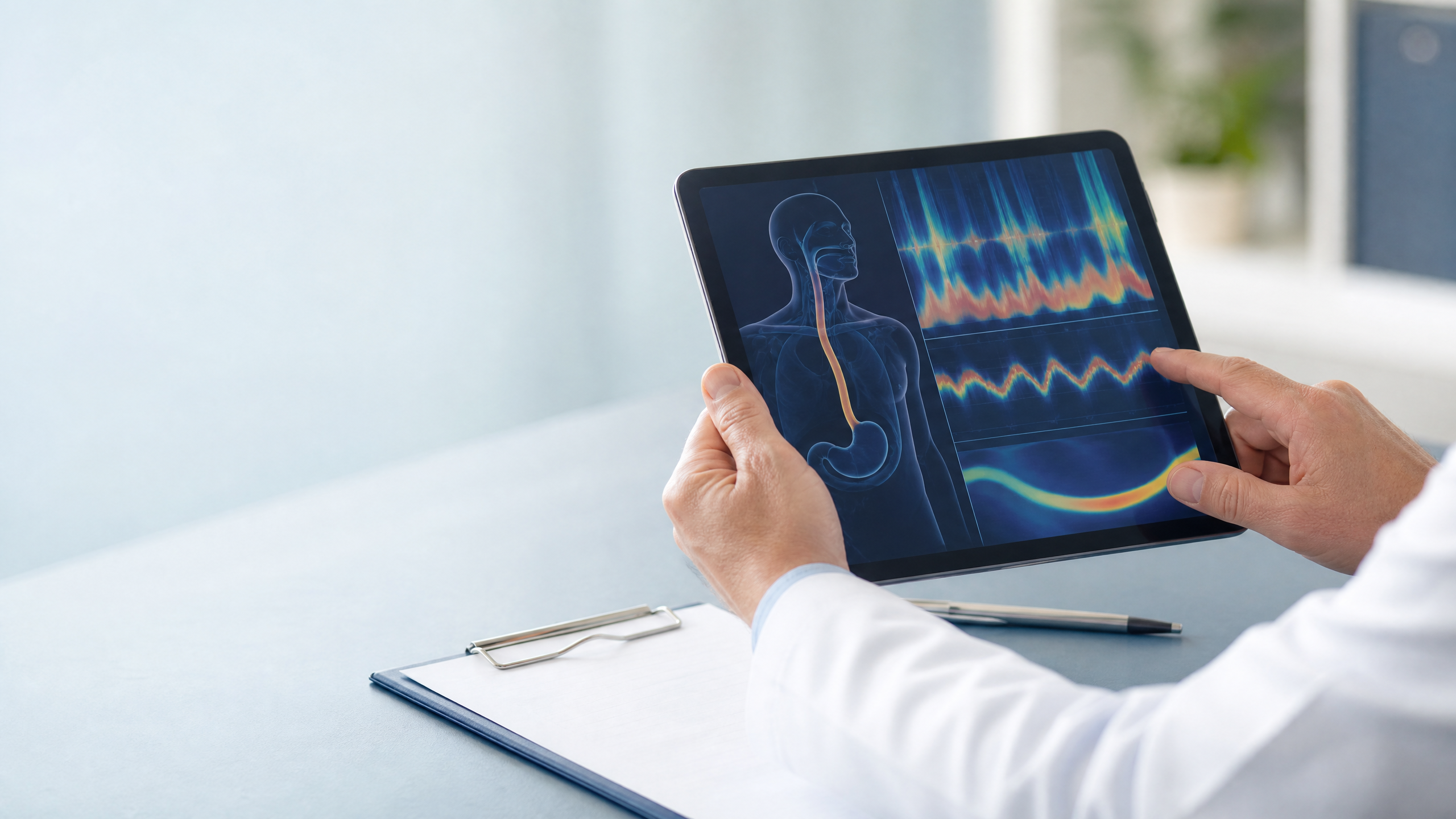 Clinician reviewing reflux testing information on a tablet