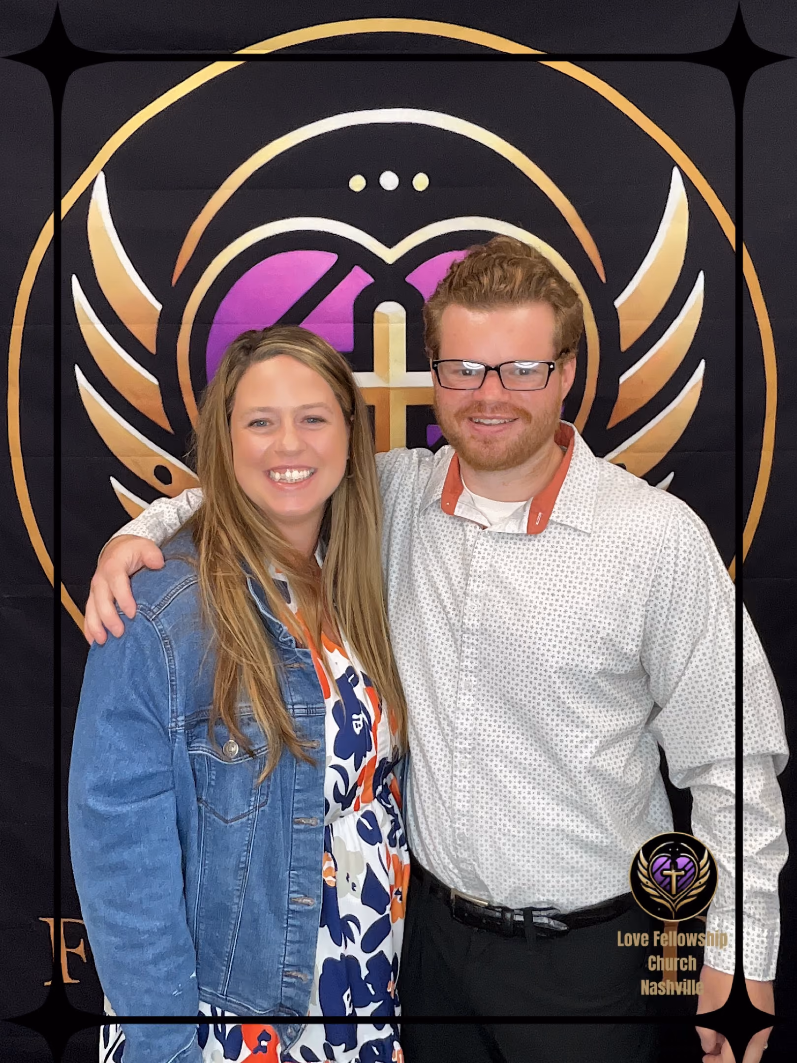 Smiling man and woman standing with arms around shoulders in front of Love Fellowship Church Nashville banner.