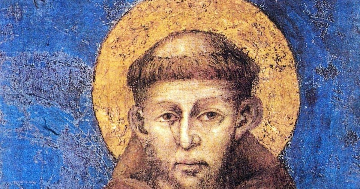 Afresco medieval de São Francisco de Assis, de hábito marrom e auréola dourada sobre fundo azul, mostrando os estigmas nas mãos.
