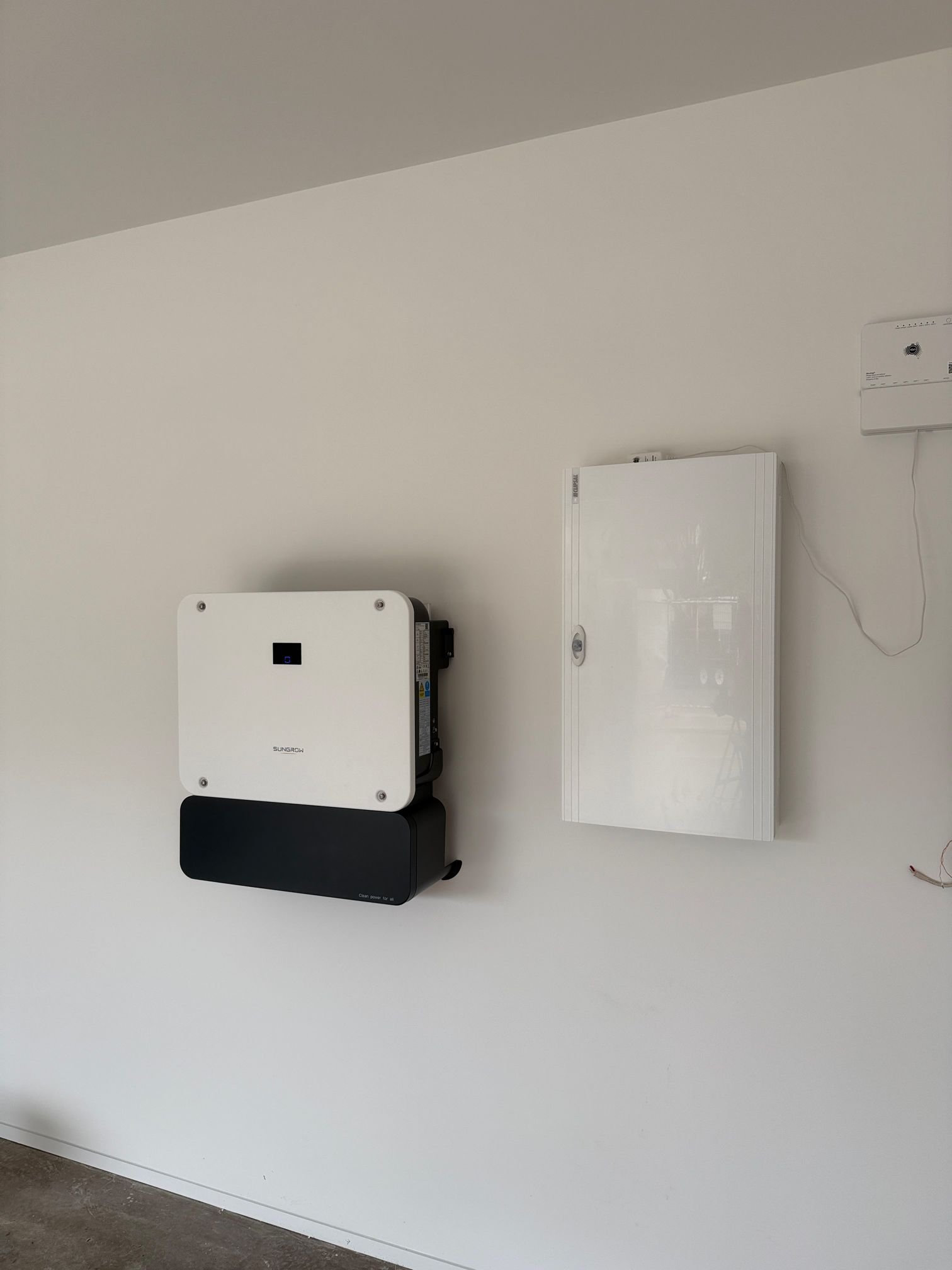 Sungrow hybrid inverter mounted on a wall at a Noosa Heads home