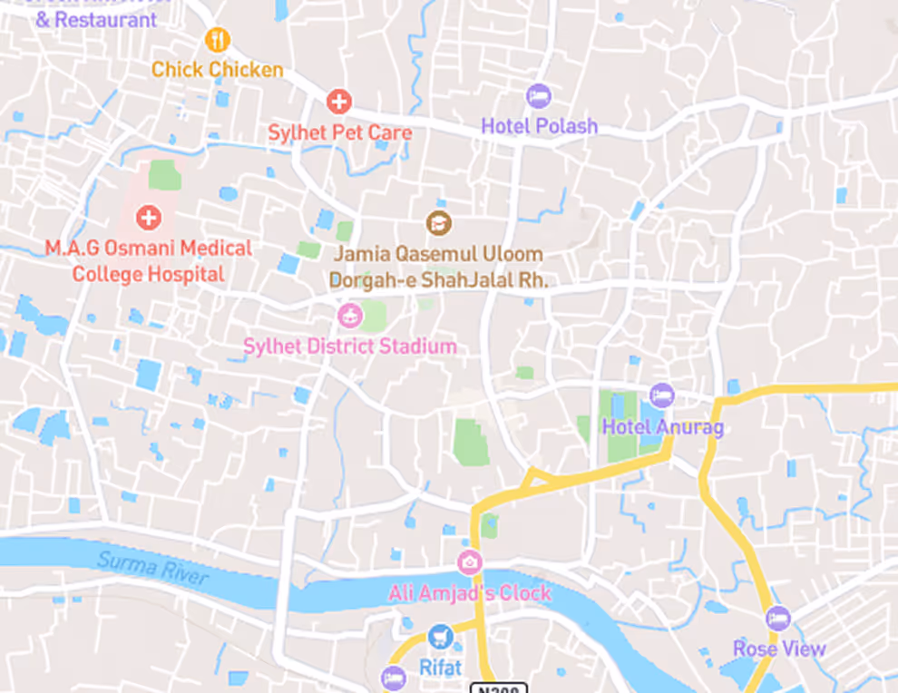 Map showing locations in Sylhet including M.A.G Osmani Medical College Hospital, Sylhet District Stadium, Ali Amjad's Clock, Hotel Polash, Hotel Anurag, Rose View, and Chick Chicken restaurant near Surma River.