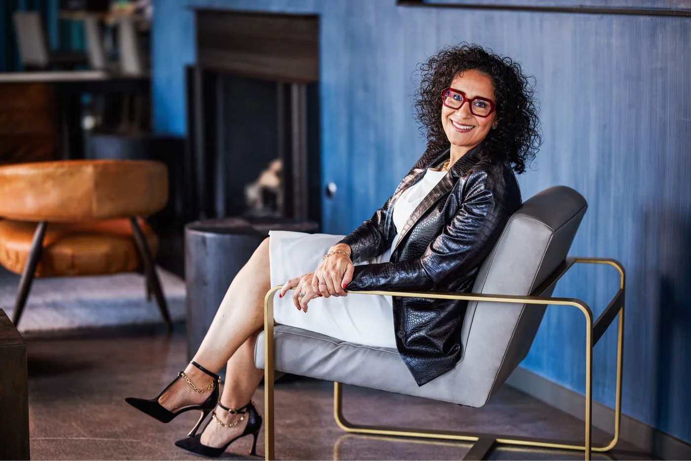 Monica Marquez seated, full portrait