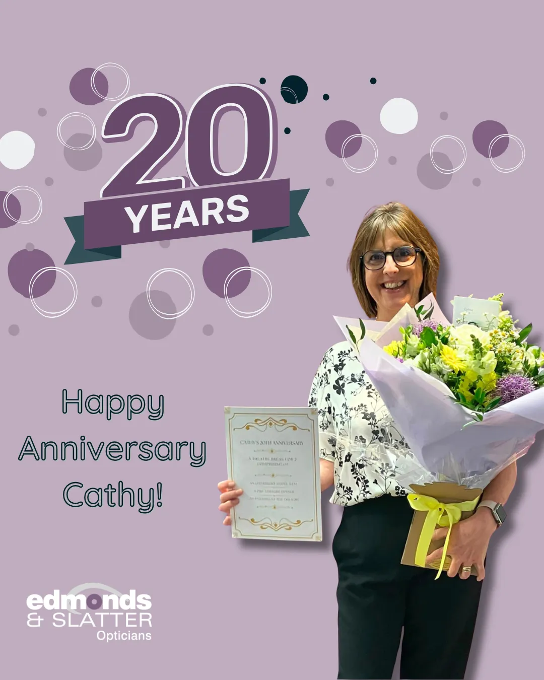 Cathy holding flowers and a certificate celebrating 20 years at Edmonds & Slatter Opticians
