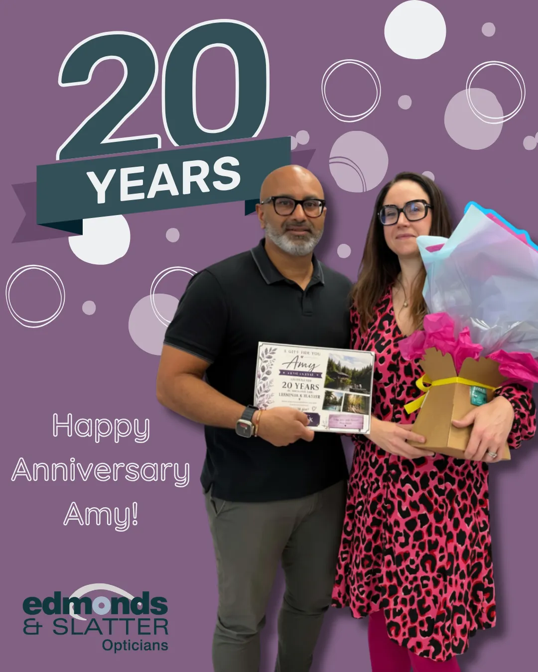 Amy receiving a certificate and gift for 20 years at Edmonds & Slatter Opticians
